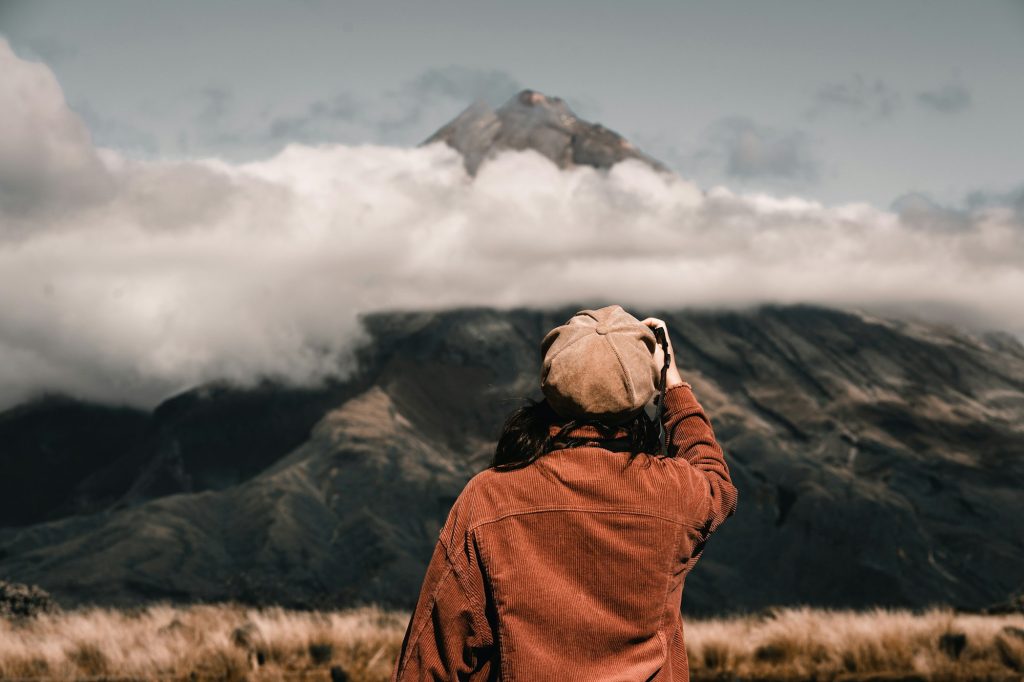 anonymous traveler looking at mountain